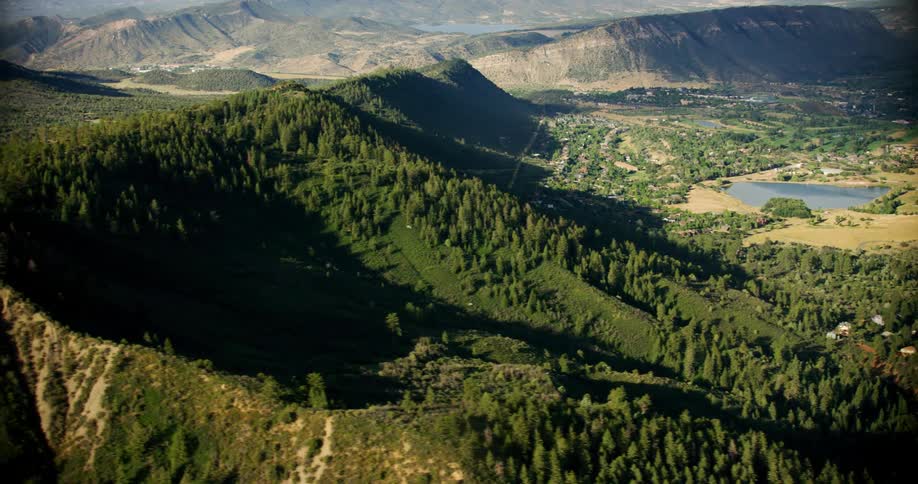 Aerial panorama of hills and mountains with coniferous vegetation
