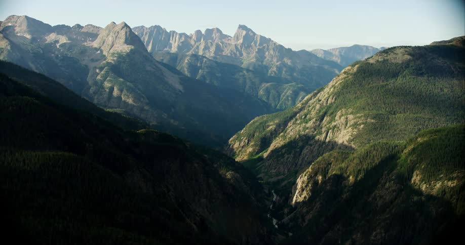 Mountain tops covered with grass on a sunny day
