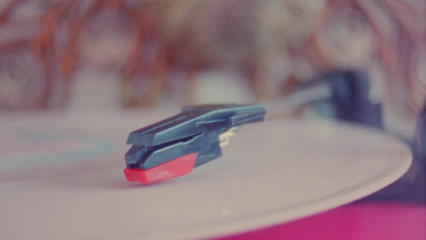 Vinyl music instrument with a moving record