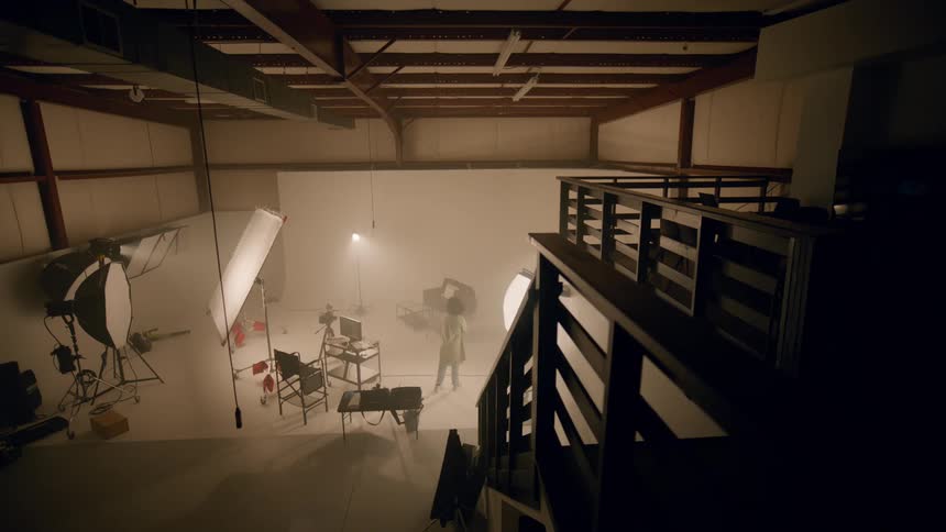 A black women walks into a studio