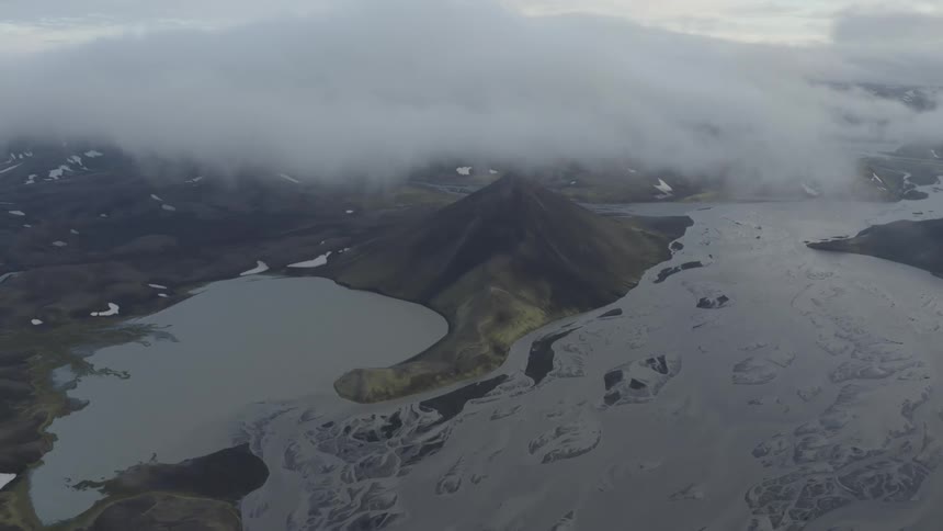 Thick fog is surrounding the coastal landscape