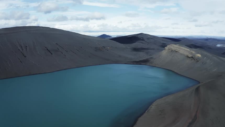 Body of water surrounded by rocky formation