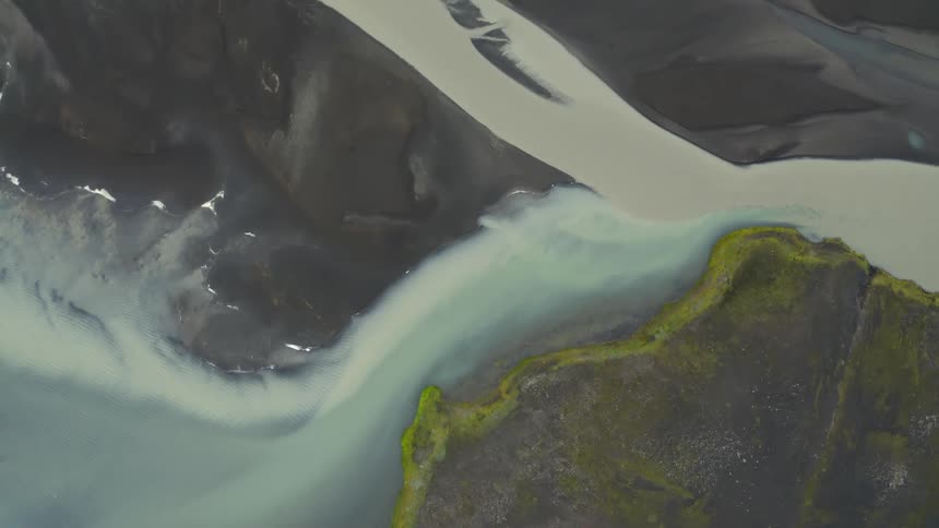 Aerial view of a river surrounded by dark sand banks