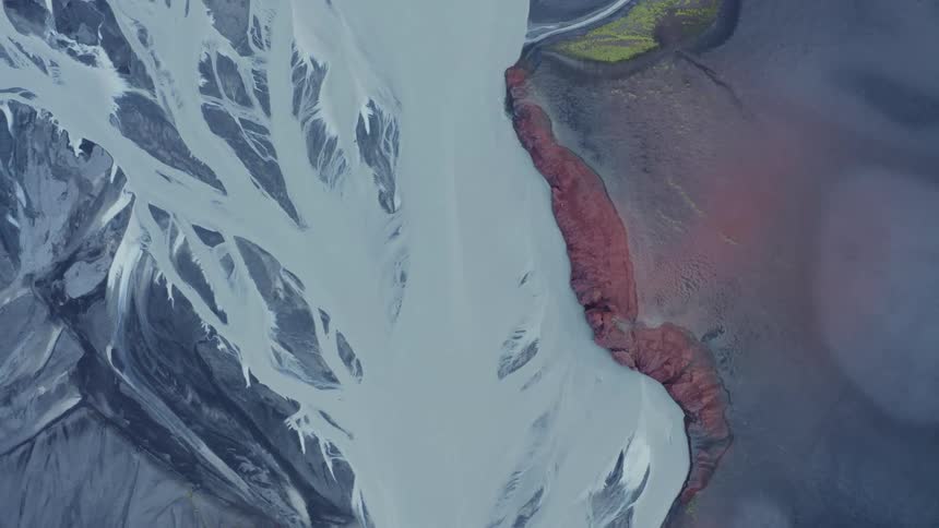 Aerial top view of icelandic glacial plateau and braided river