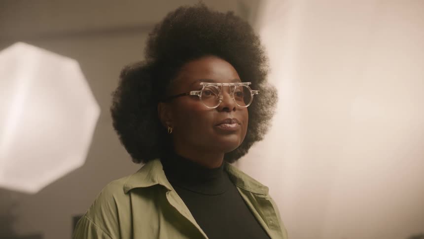 Portrait of a woman with prescription glasses in a studio with lighting
