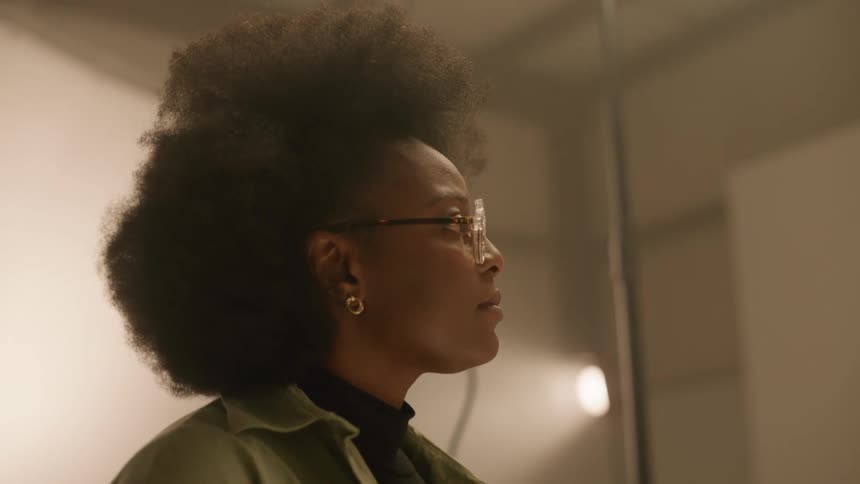 Woman is talking to someone and standing in a room