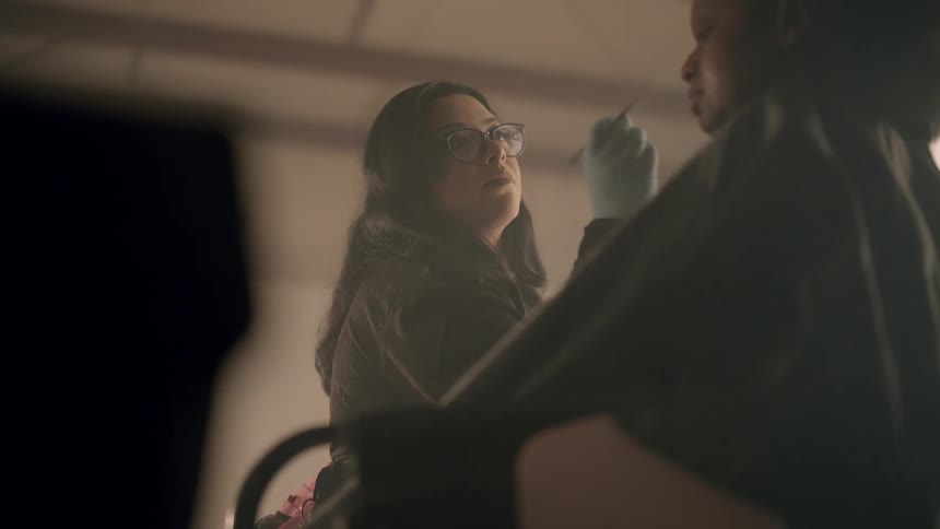 Woman is applying makeup on another person