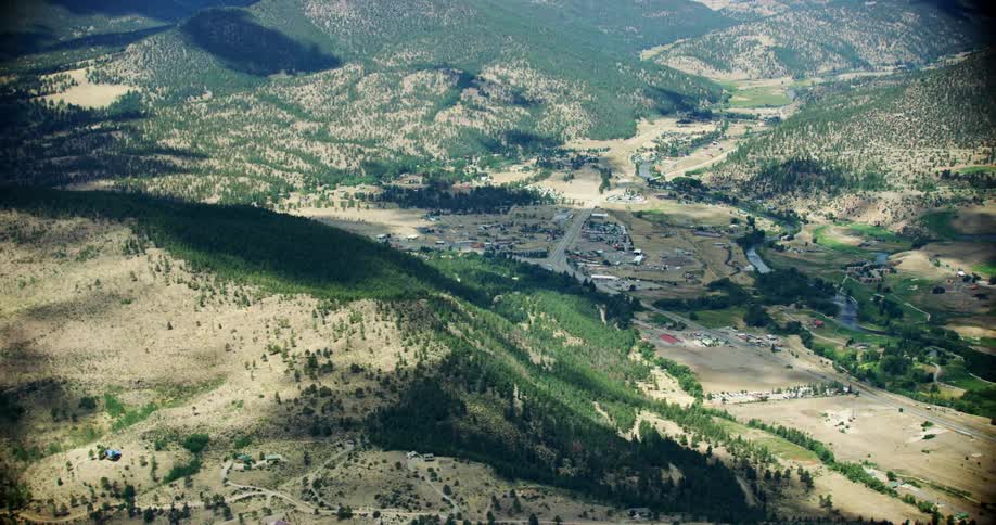 A small town near mountains and forests