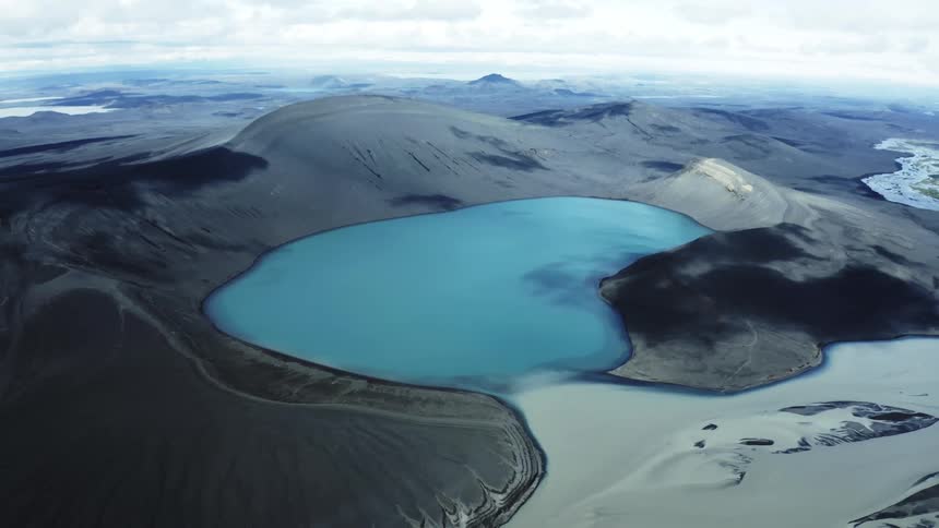 Small body of water in the valley on a cloudy day