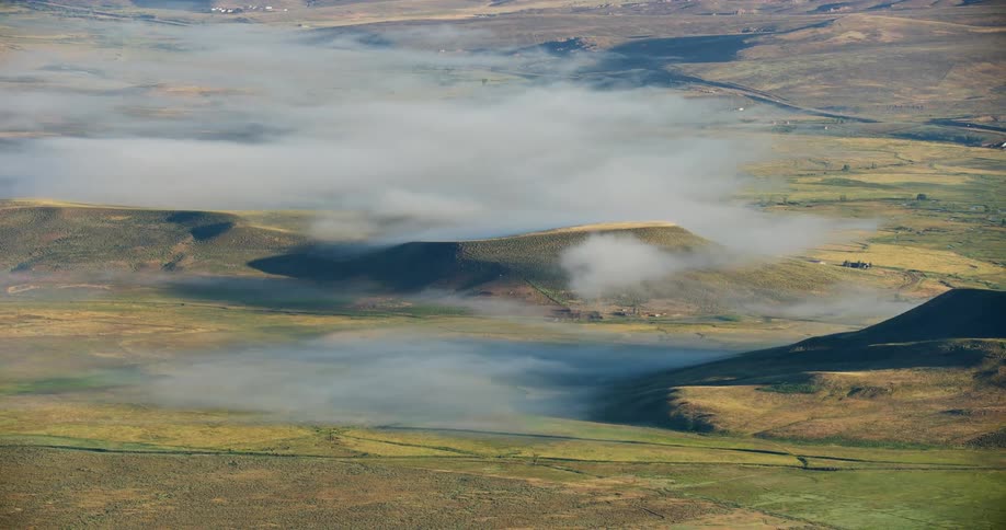 Fog covering the grassland plains in the spring