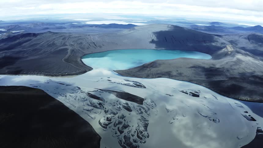 Grey river and blue lake