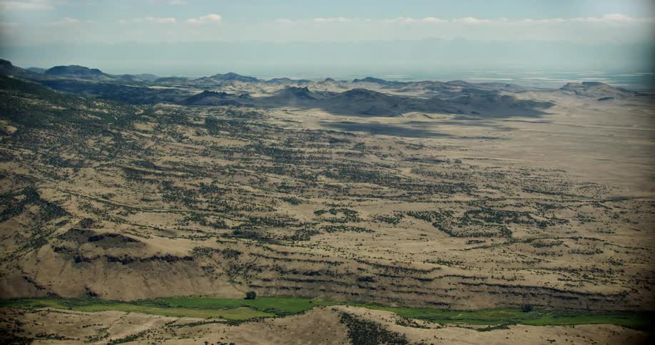 Wide shot of the desert land and horizon