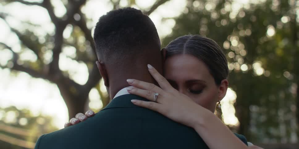 Man and woman are dancing slowly together outdoors
