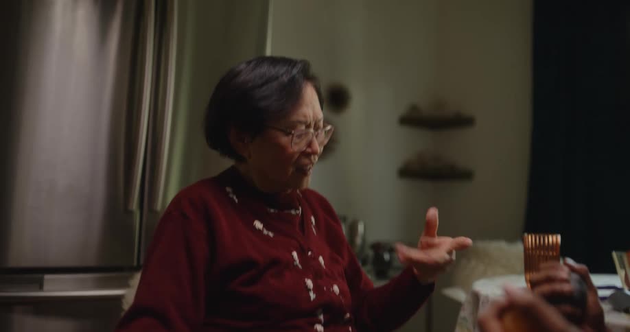 Nurse helps an elderly woman with physical therapy at home