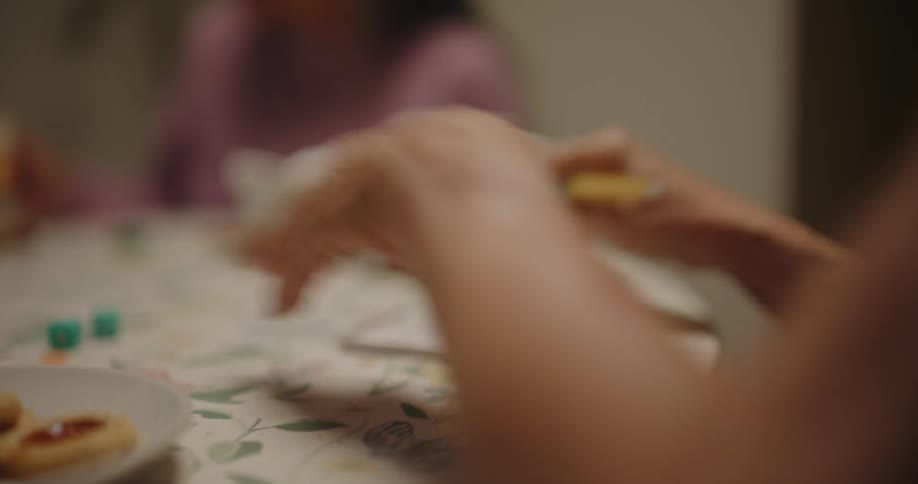Three women play a dice game