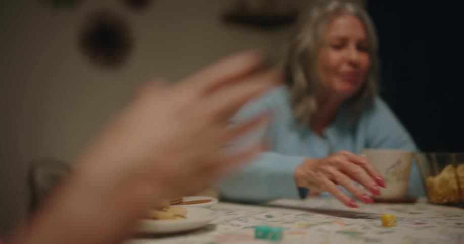 A clip of old friends plying a dice game in the room