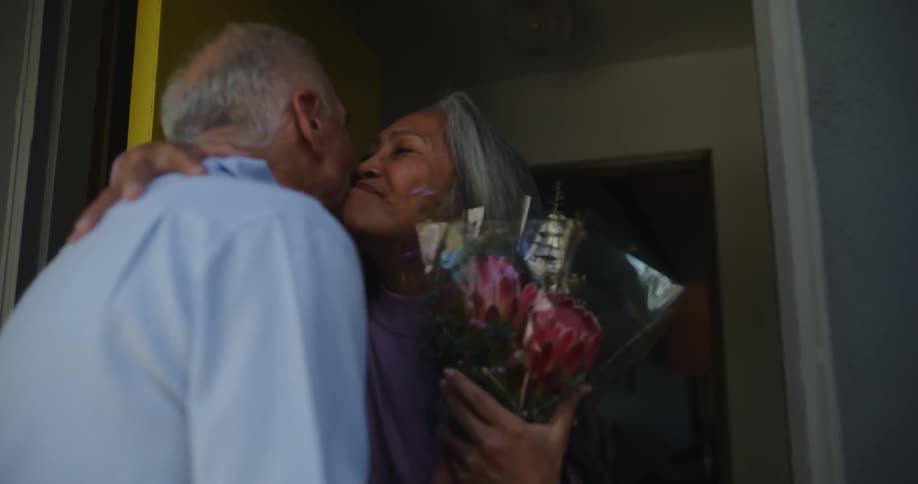 Man is giving a woman flowers