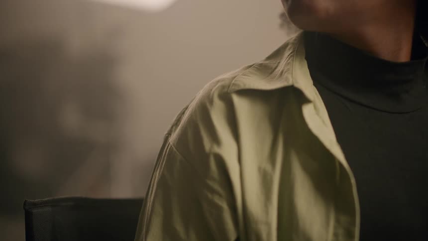 Close up of a person tapping someone on the shoulder
