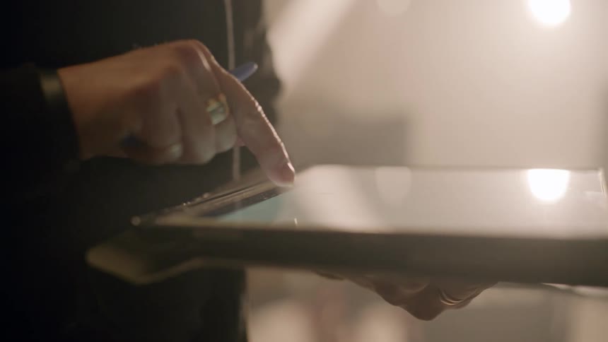 Hands of two women using a tablet