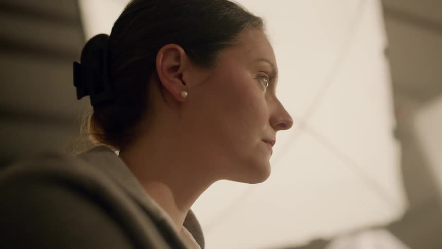 Woman nodding her head and smiling indoors