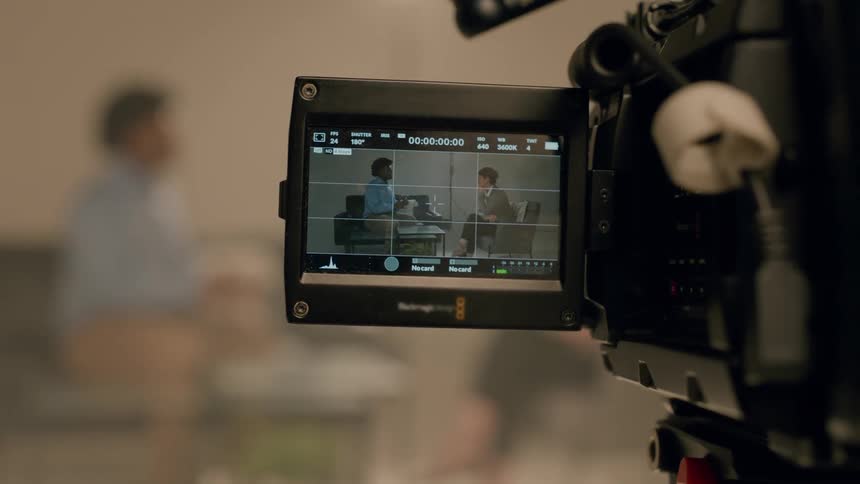 Two people being filmed while having a discussion