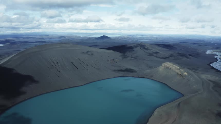 Body of water in the valley on a cloudy day