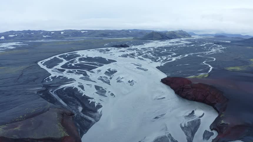 An aerial flyover of glacial rivers