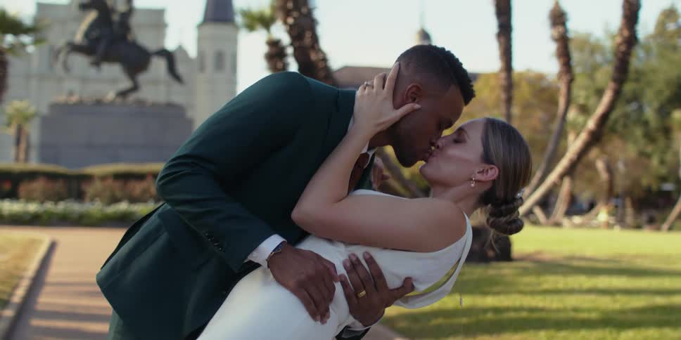 Bride and groom kissing during photo session outdoors