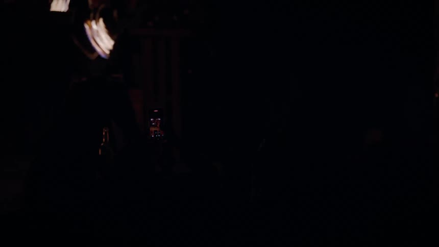 A fire dancer performing a show at night