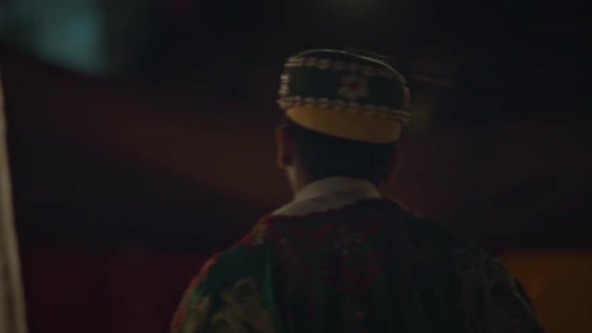 A man dances and spins his head around at a party