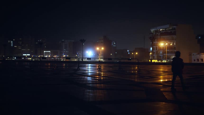 A night clip of a person walking on the street