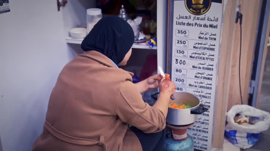 A muslim woman prepares food