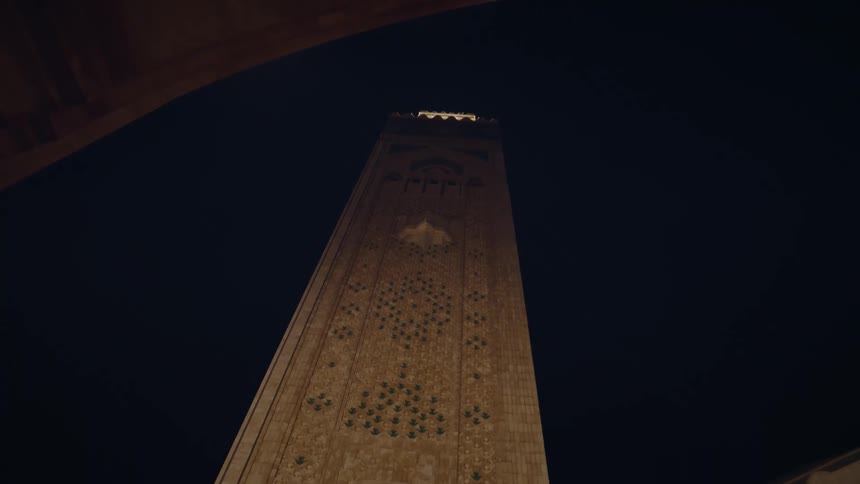 Exterior architecture of the tower of a cathedral at night
