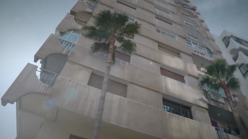 Facade of an apartment building under a blue sky