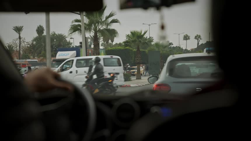 A clip of a person driving in a traffic area in morocco