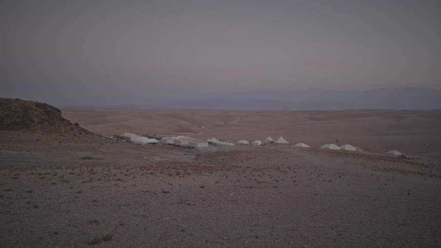 Tents in the middle of the desert one morning