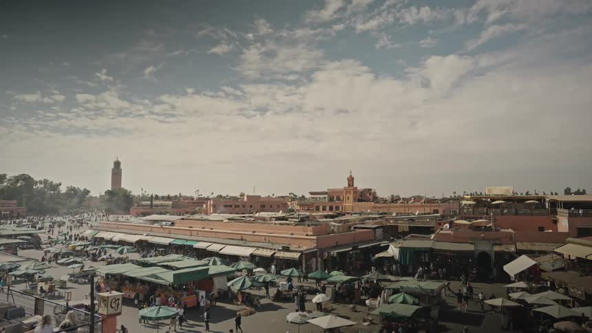 A crowded outdoor market in a city on the middle east Marrakesh Djemaa el Fna