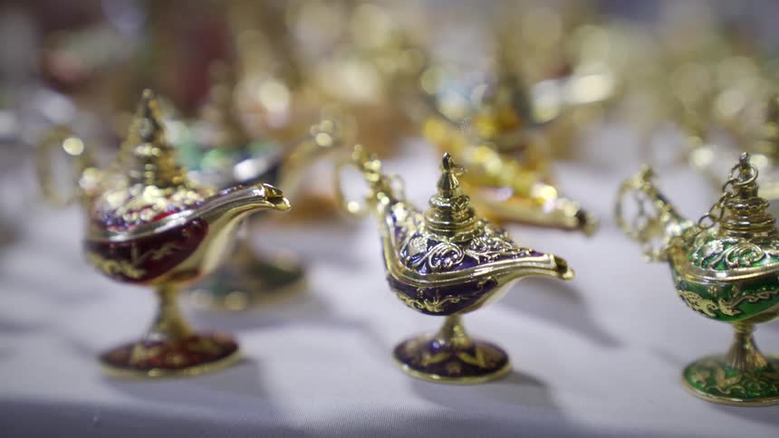 A group of colorful genie lamps sit on a table