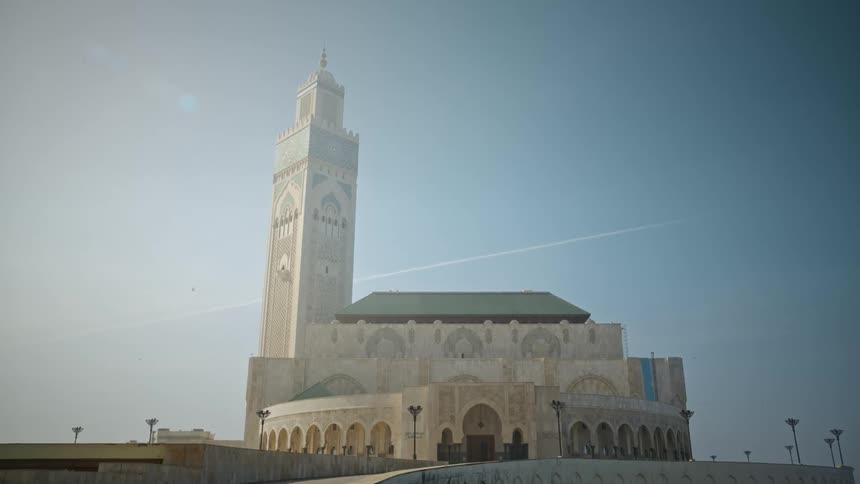The sun is shining down on the church on a clear day