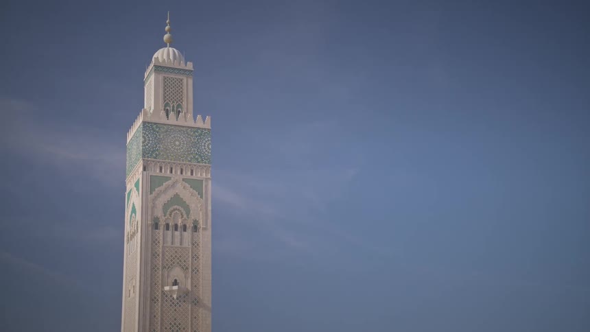 The tower of a mosque against the sky