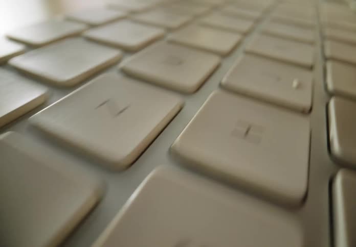 Female using a computer keyboard to type