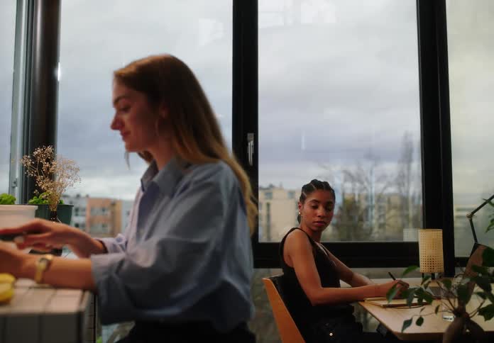 A woman chopping vegetables at the office