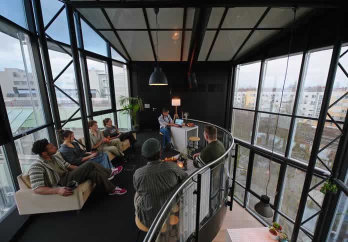 A group of friends having a conversation in a room
