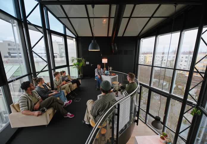 A group of friends having a meeting in a room