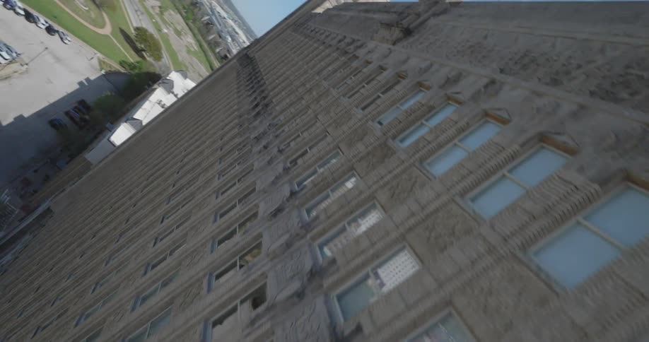 A large apartment building in the city on a sunny day