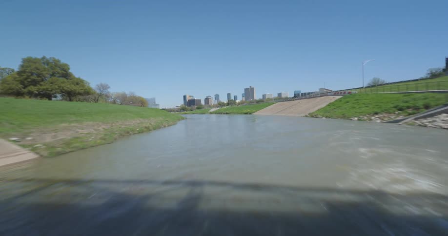 A river near a highway and city