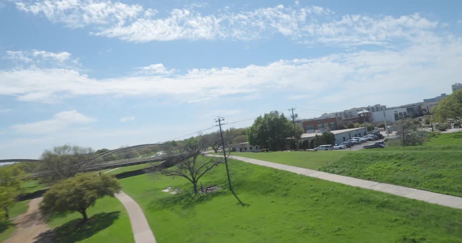 An aerial clip of a community filled with green vegetation