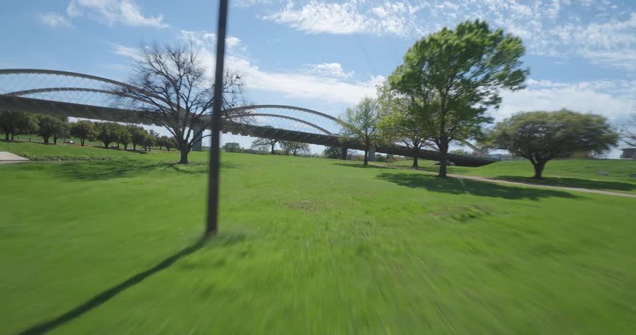 Panorama of a municipal park with a river in a city during the day