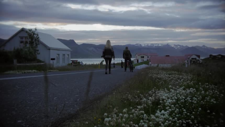 A couple walking around a small rural town in the mountains