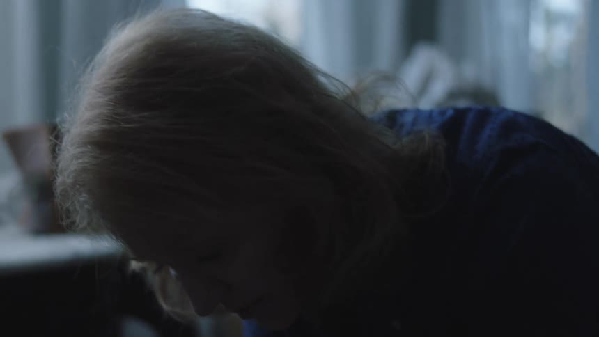 An elderly woman sad depressed and crying in the room